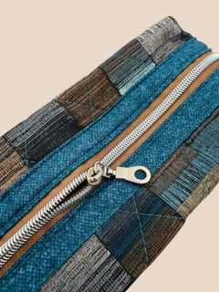 Blue and Earth Tone Patchwork Holland pouch, close-up of the copper and teal top zipper — handmade by The Cozy Daisy