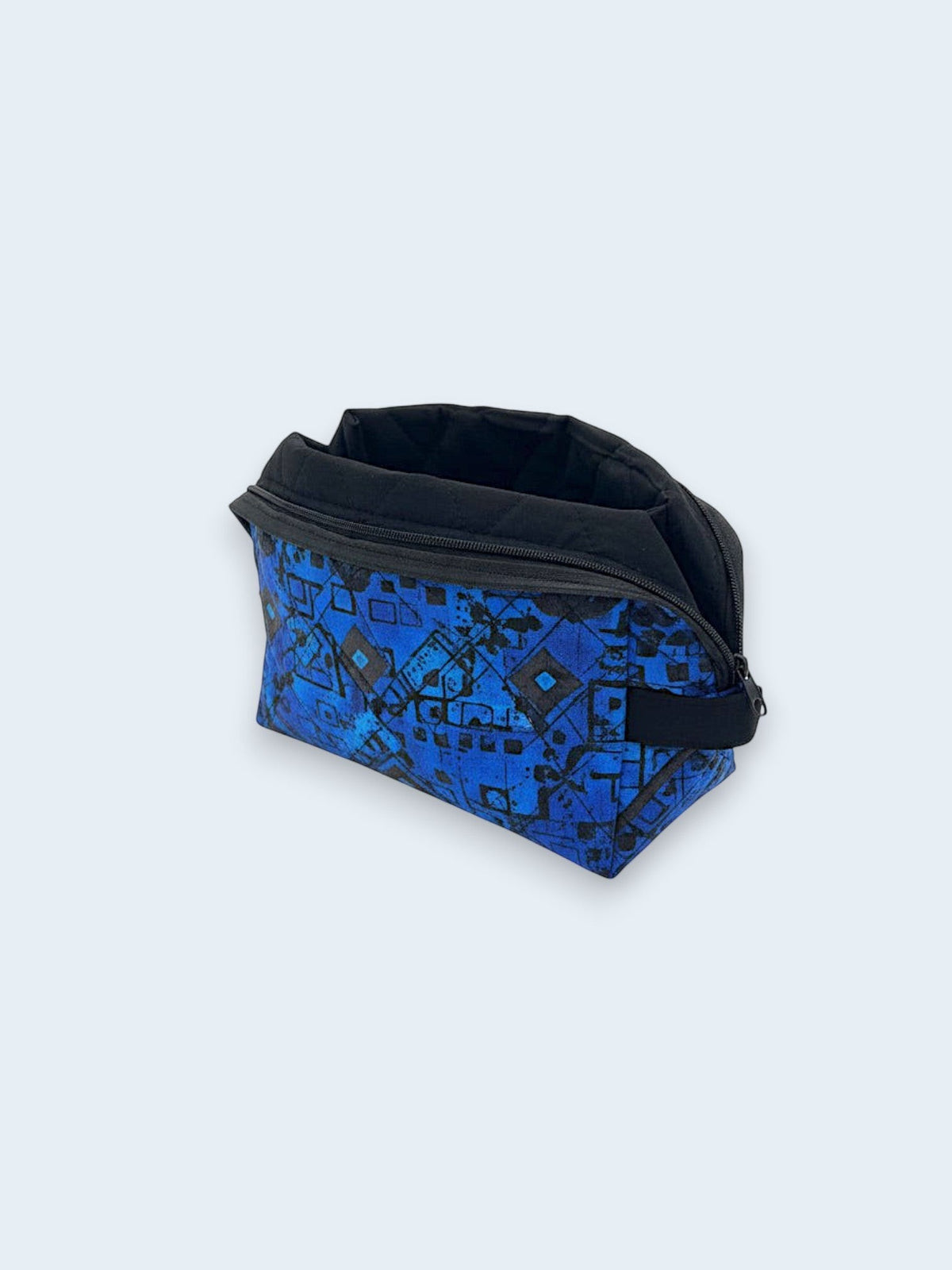 Blue Geometric Holland pouch, open and showing the black interior lining — handmade by The Cozy Daisy
