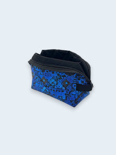 Blue Geometric Holland pouch, open and showing the black interior lining — handmade by The Cozy Daisy