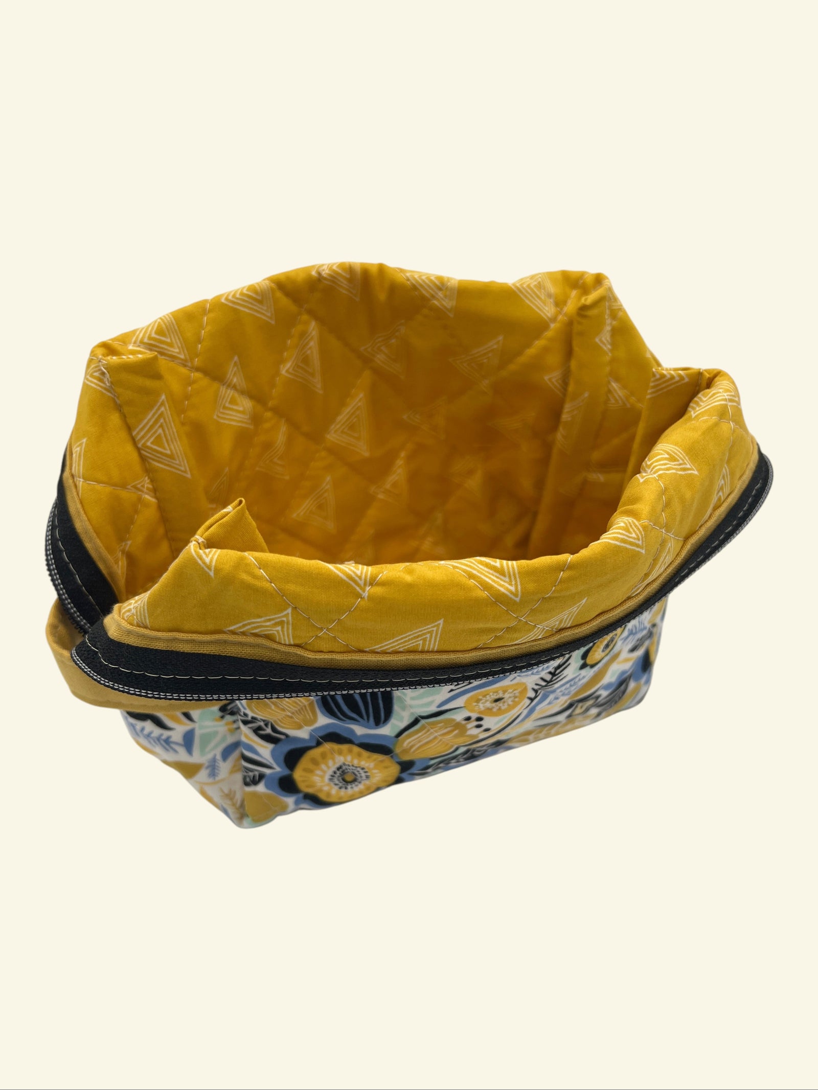 Blue and Gold Wildflower Holland pouch, open and showing the yellow patterned interior lining — handmade by The Cozy Daisy