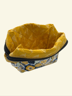 Blue and Gold Wildflower Holland pouch, open and showing the yellow patterned interior lining — handmade by The Cozy Daisy