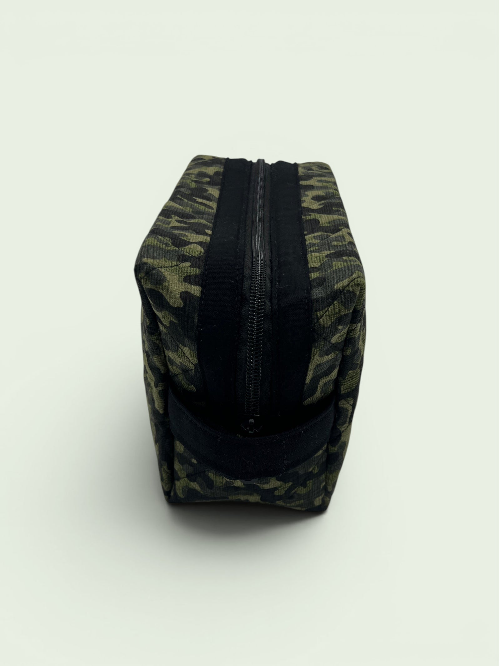 Camouflage Holland pouch, end view showing the boxy shape and carry handle — handmade by The Cozy Daisy