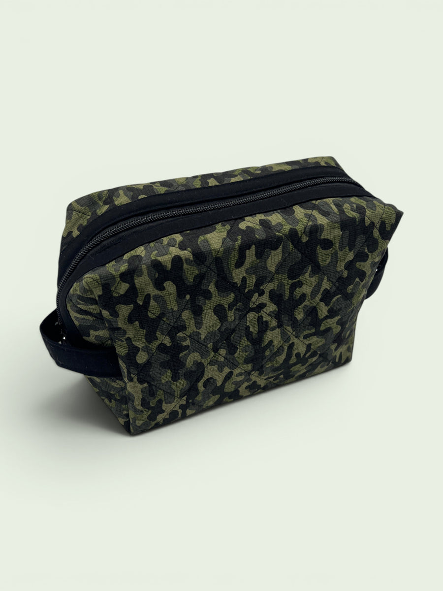 Camouflage Holland pouch, front three-quarter view, zipped closed — handmade by The Cozy Daisy
