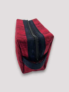 Distressed Ruby Holland pouch, end view showing the boxy shape and navy carry handle — handmade by The Cozy Daisy