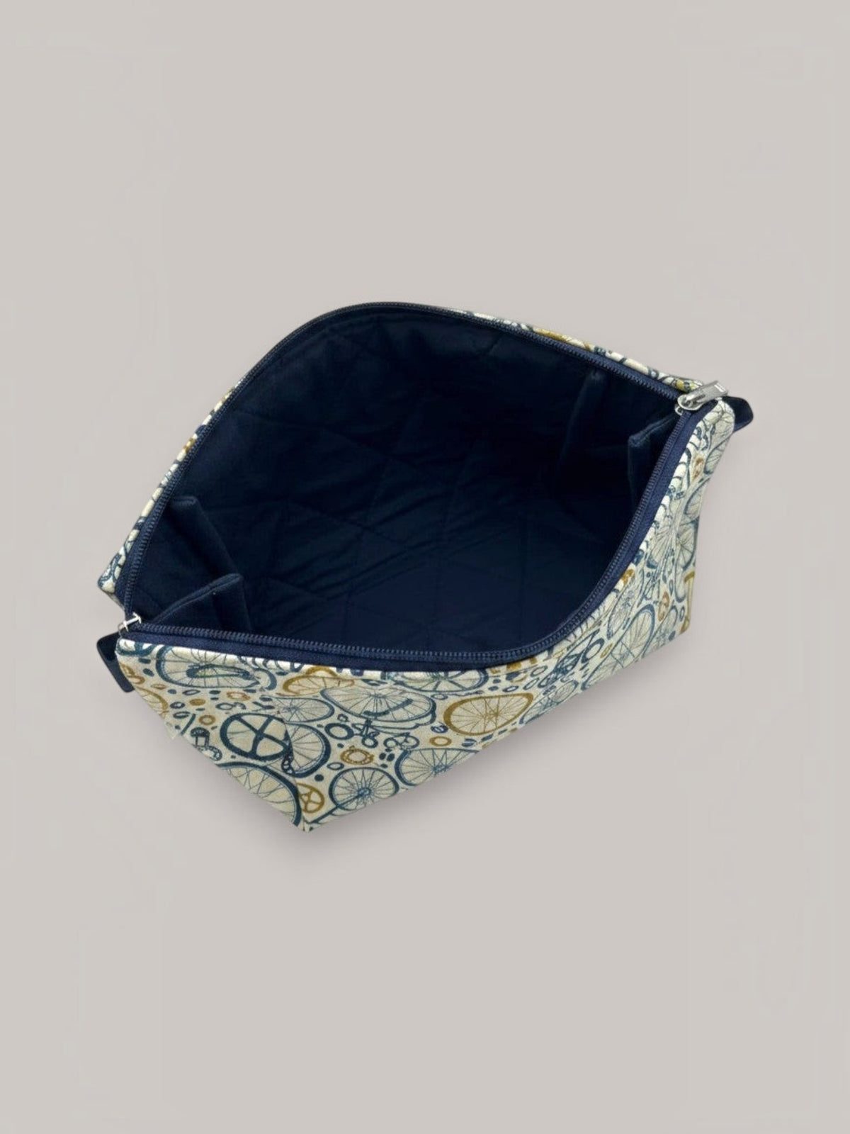 Wheels Go Round Holland pouch, open and showing the navy interior lining — handmade by The Cozy Daisy