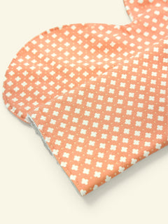 Peach burp cloth close-up