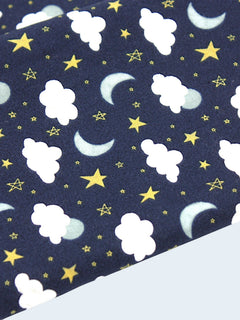 The Cozy Daisy handmade burp cloth in dark blue sky print with white clouds, yellow stars, and crescent moons.